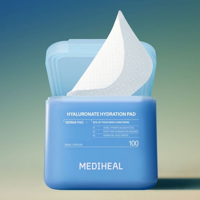Blue container of hydration pads with one lifted textured white pad showing soft material and shape
