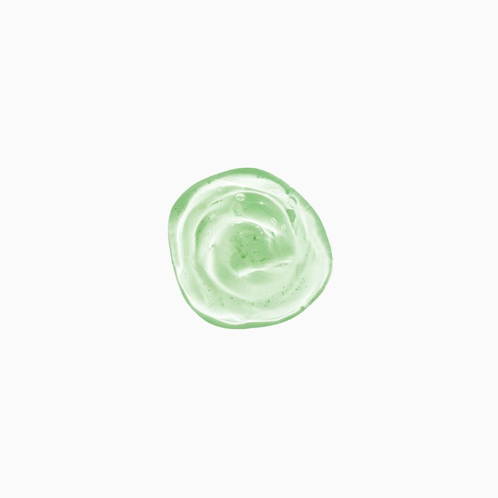 Swirl of light green gel with small bubbles, illustrating a gentle cleansing shampoo texture.
