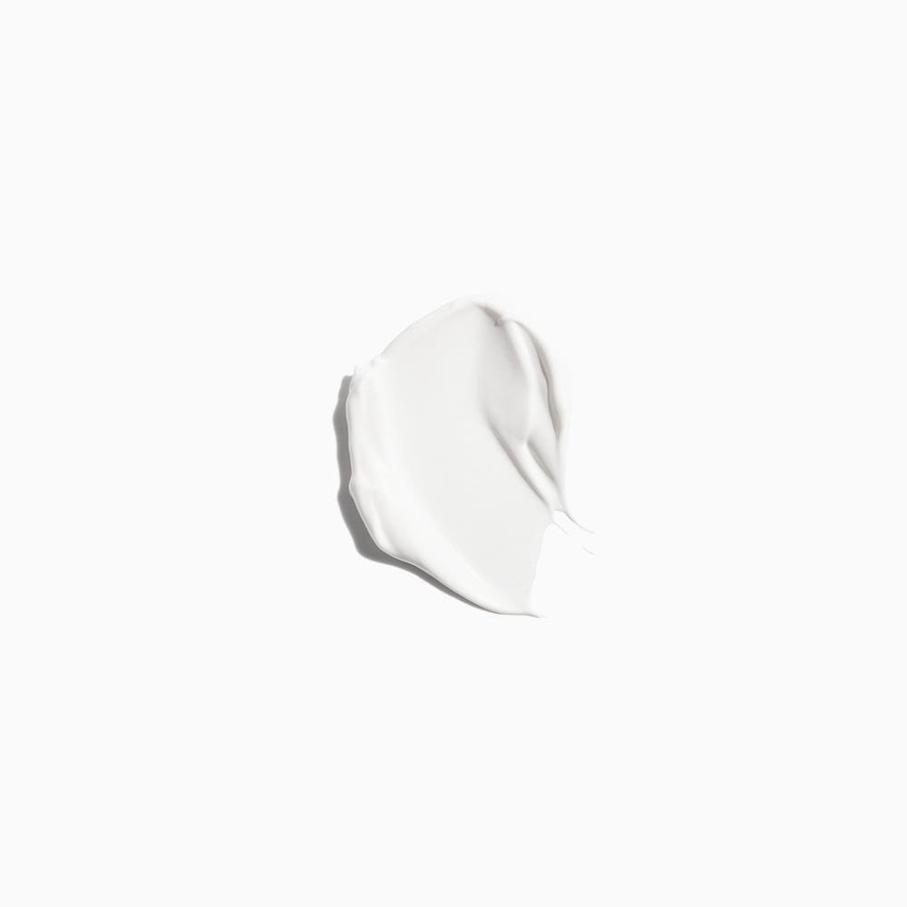 Smooth white cream swatch on white background showing texture of a repairing herbalism treatment product
