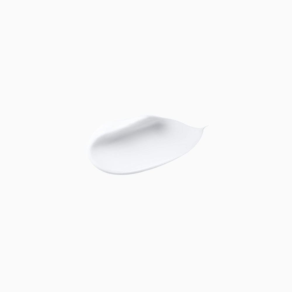 Smooth white cream texture swatch on white background representing reparative acid conditioner formula