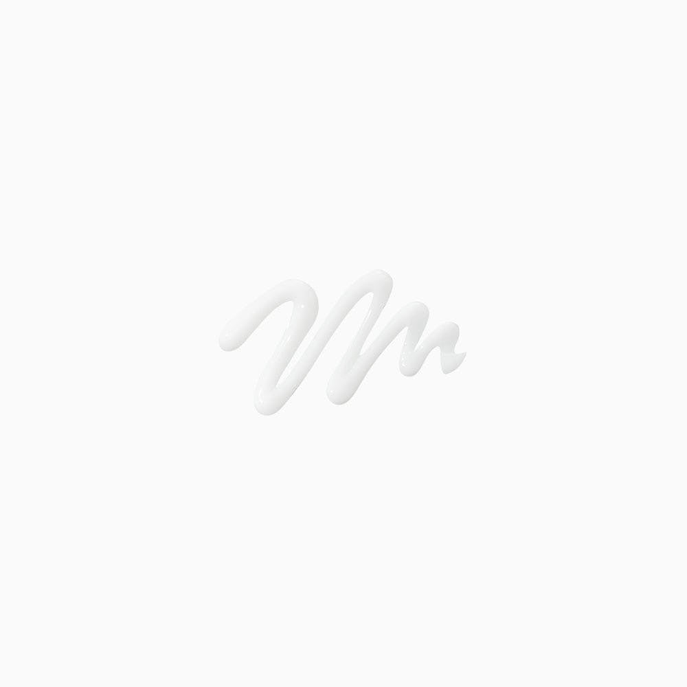 White creamy hair ampoule product swirled in a zigzag pattern on a plain white background