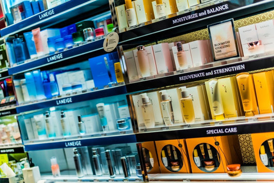 Cosmetic shelves with various skincare products in a store setting
