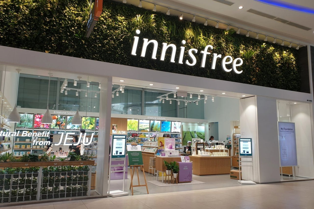 Innisfree store entrance with green wall, showcasing natural beauty products from Jeju.