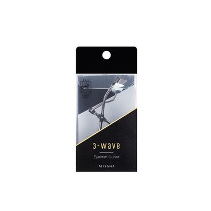 Compact eyelash curler in sleek black and silver packaging designed for easy curling and smooth use