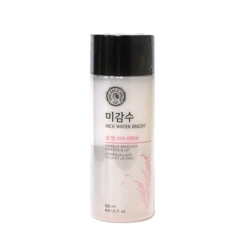 White cylindrical bottle of rice water lip and eye makeup remover with black cap on white background