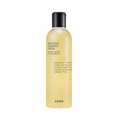 Tall translucent bottle with golden liquid propolis toner and black flip cap on white background