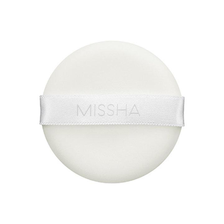 Round white powder puff with MISSHA logo printed on a smooth satin ribbon for shine control application
