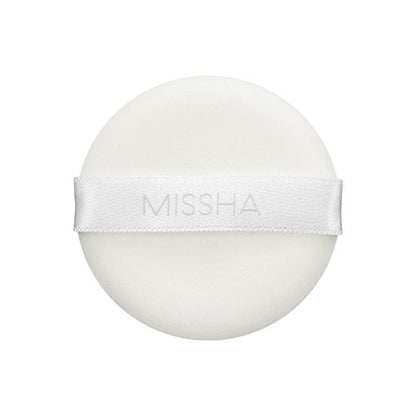 Round white powder puff with MISSHA logo printed on a smooth satin ribbon for shine control application