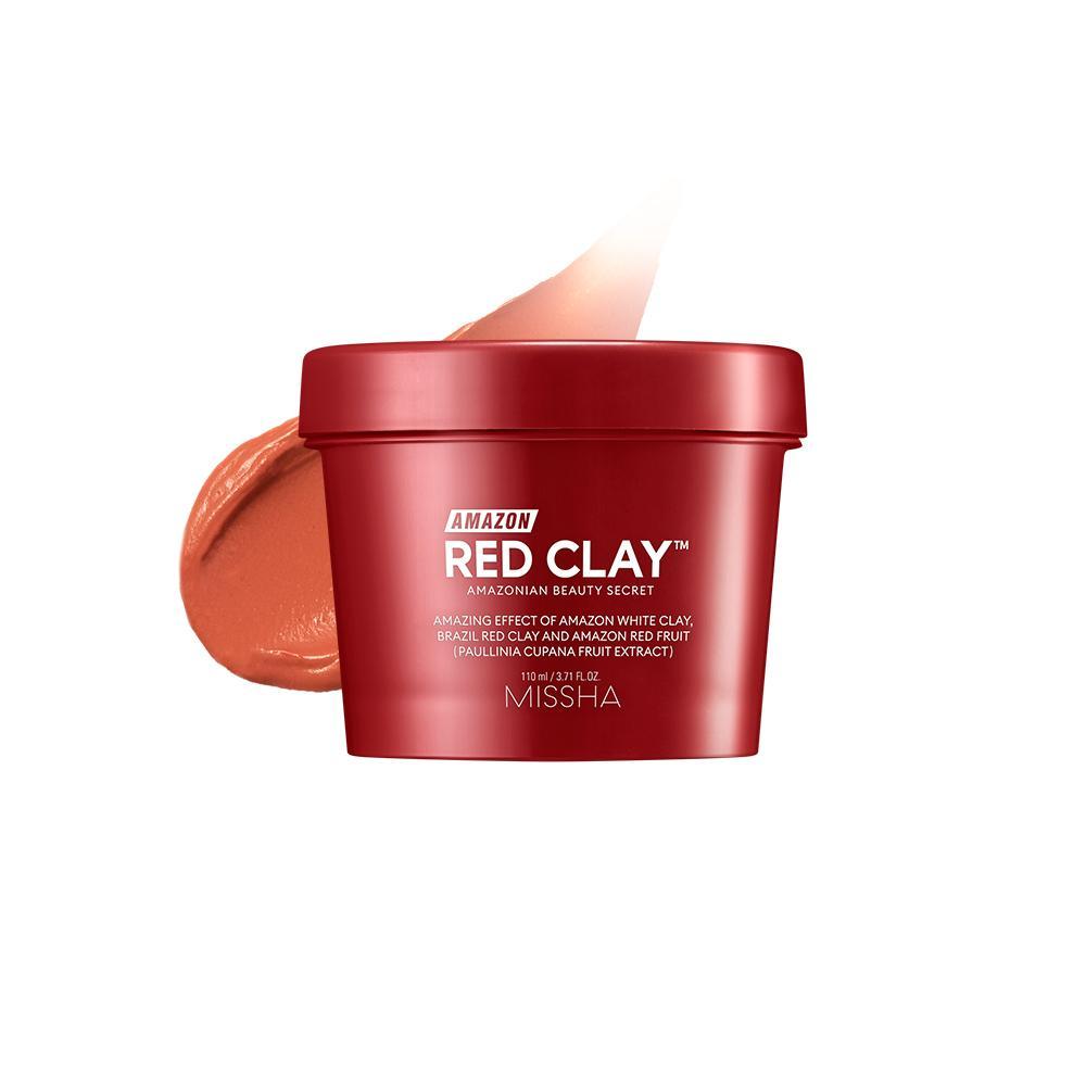 Red clay facial mask container with smooth terracotta-colored clay texture on white background