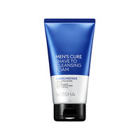 Blue and white tube of dual-use men's cleansing foam with black flip cap on plain white background