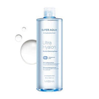 Tall clear blue-tinted bottle of Super Aqua Ultra Hyalron micellar cleansing water with water droplets nearby