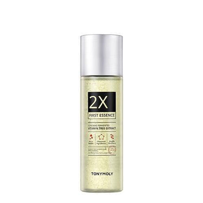 Clear bottle of 2X First Essence with silver cap featuring fermented vitamin tree extract for enhanced hydration
