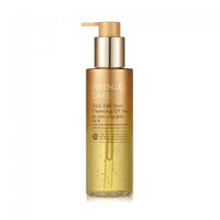 Transparent gold pump bottle of gentle cleansing oil gel with visible bubbles, highlighting soothing skincare benefits