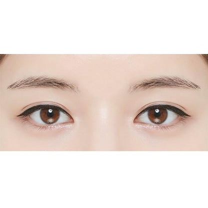 Close-up of eyes with smooth black eyeliner applied for a sharp, defined look showcasing effortless application.
