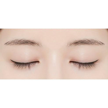 Close-up of closed eyes with precise, smooth black eyeliner application highlighting effortless definition.