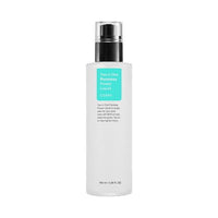 Clear white bottle of pore-reducing liquid with black pump and turquoise label on plain white background