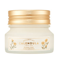 Frosted jar of moisture cream with gold lid and floral calendula design on white background
