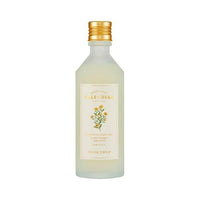 Frosted glass bottle with gold cap and floral label containing hydrating calendula moisture toner