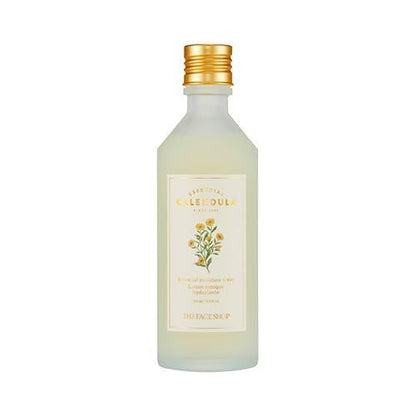 Frosted glass bottle of hydrating calendula toner with gold cap and floral label on white background