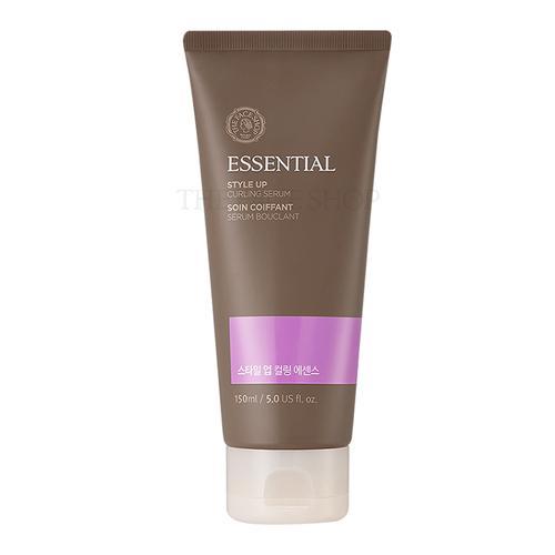 Brown squeeze tube of curling serum with purple label accent and white flip cap on white background
