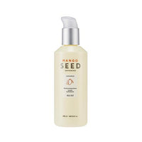 Creamy lotion bottle with silver pump labeled for intense hydration featuring mango seed and ceramide ingredients