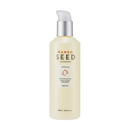Tall light beige bottle of moisturizing toner with pump cap and minimalist mango seed label design on white background