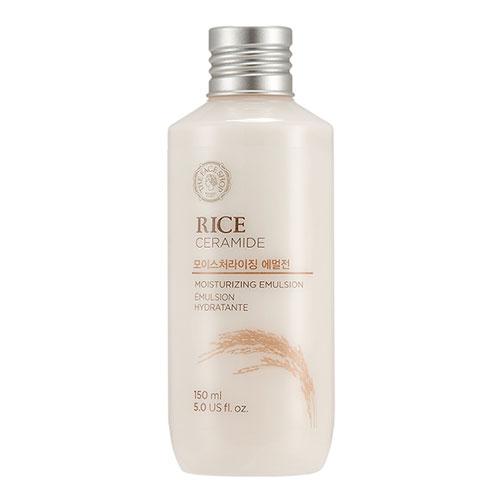 Cream-colored bottle of hydrating rice and ceramide emulsion with silver screw cap and rice illustration on label