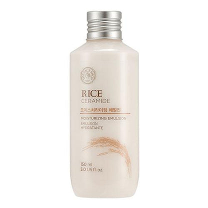 Cream-colored bottle of hydrating rice and ceramide emulsion with silver screw cap and rice illustration on label