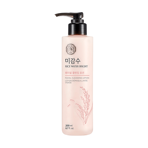 Tall translucent bottle of gentle facial cleansing lotion with pump dispenser and rice grain illustration on front