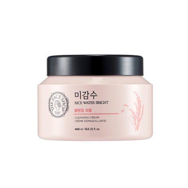 Pale pink jar of gentle rice water cleansing cream with black lid and subtle rice illustration on front label