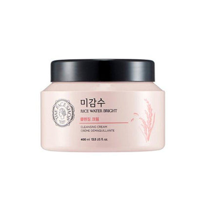 Pale pink jar of gentle rice water cleansing cream with black lid and subtle rice illustration on front label