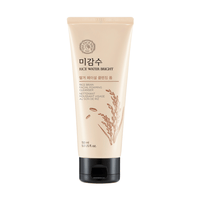 Beige tube of rice bran foaming cleanser with black cap and rice illustration, designed for deep cleansing skincare routine