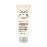 Cream-colored tube of foaming cleanser with silver cap and detailed vintage-style label on white background
