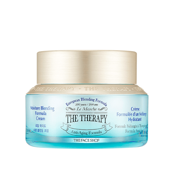 Blue glass jar of hydrating anti-aging cream with gold lid and European blending formula label