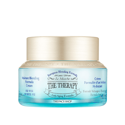 Blue glass jar of hydrating anti-aging cream with gold lid and European blending formula label