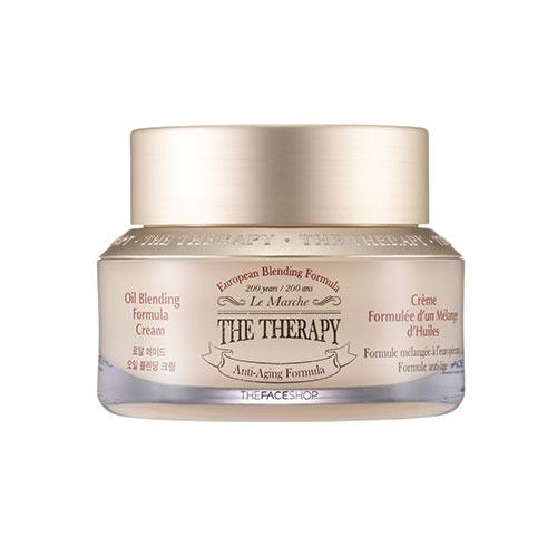 Jar of anti-aging cream with oil blending formula in a light beige container with metallic gold lid