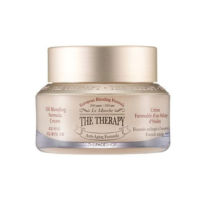 Jar of anti-aging cream with oil blending formula in a light beige container with metallic gold lid