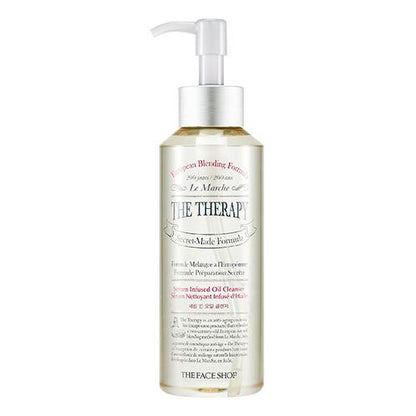 Clear pump bottle of serum infused oil cleanser with moisturizing formula and elegant white and gold label design