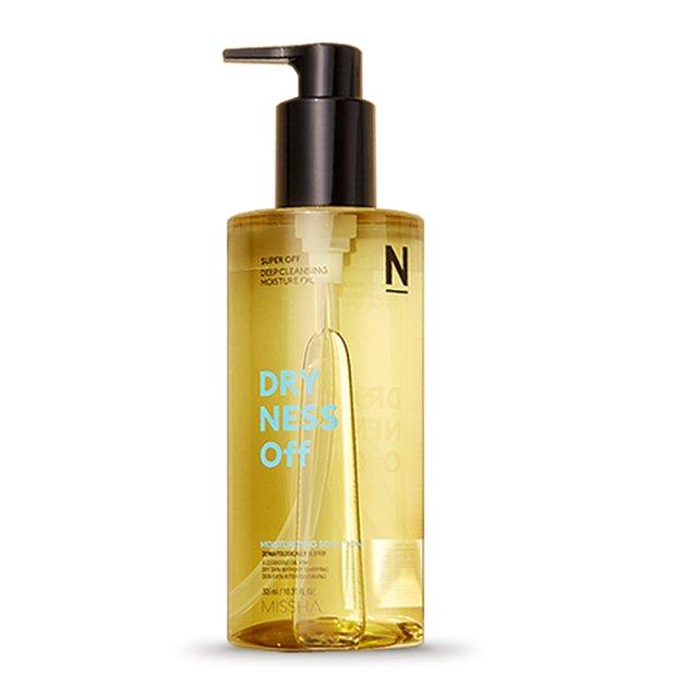 Clear yellow cleansing oil bottle with black pump dispenser labeled for dryness relief and thorough cleansing benefits