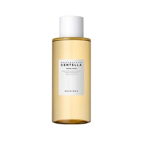 Clear amber bottle of Madagascar Centella toning toner with white cap and minimalist label on white background