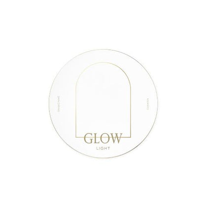 White round compact cushion case with minimal gold arch design and glow light text on clean white background