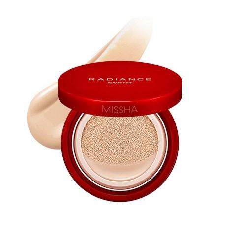 Red compact cushion foundation with beige radiance-perfecting formula swatch behind on white background