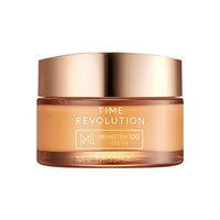 Golden jar of anti-aging cream with sleek metallic lid against a clean white background