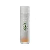 Frosted glass bottle of calming essence with green artemisia illustration and minimalist white text on white background