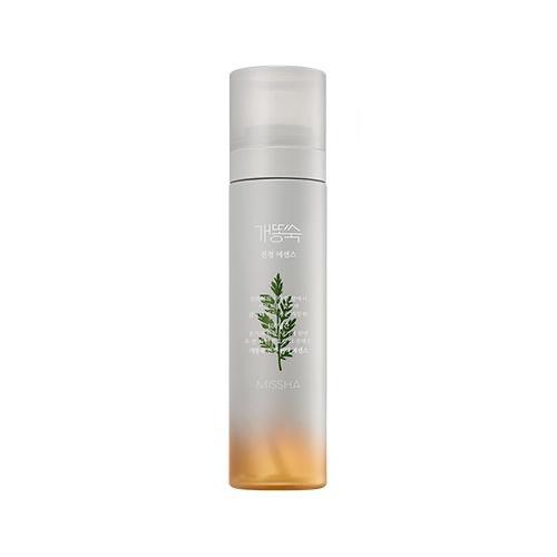 Tall frosted spray bottle with green artemisia illustration and calming essence mist for soothing skin irritation
