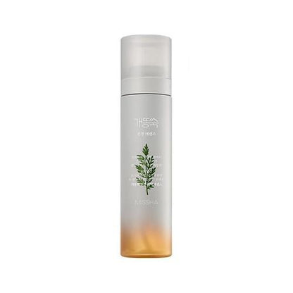 Tall frosted spray bottle with green artemisia illustration and calming essence mist for soothing skin irritation