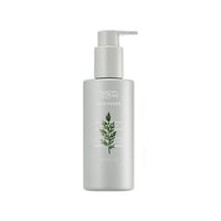 Matte white pump bottle with green Artemisia leaf illustration and soothing feminine wash formula on front label