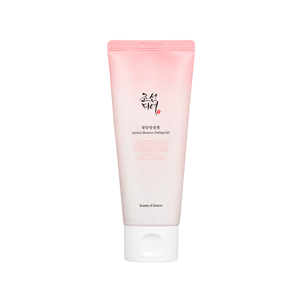 Pink and white gradient tube of gentle exfoliating apricot blossom peeling gel with black and red text on white cap