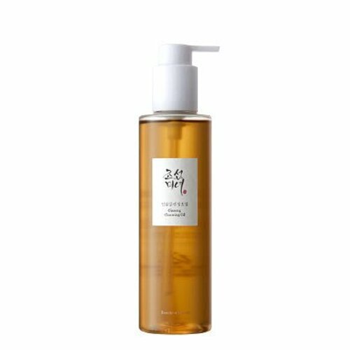 Tall transparent bottle with amber cleansing oil and white pump dispenser for gentle makeup removal