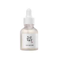 Frosted glass dropper bottle with white cap containing brightening serum with Korean label on white background